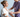 A healthcare professional attaches a wearable health sensor to a patient's arm.
