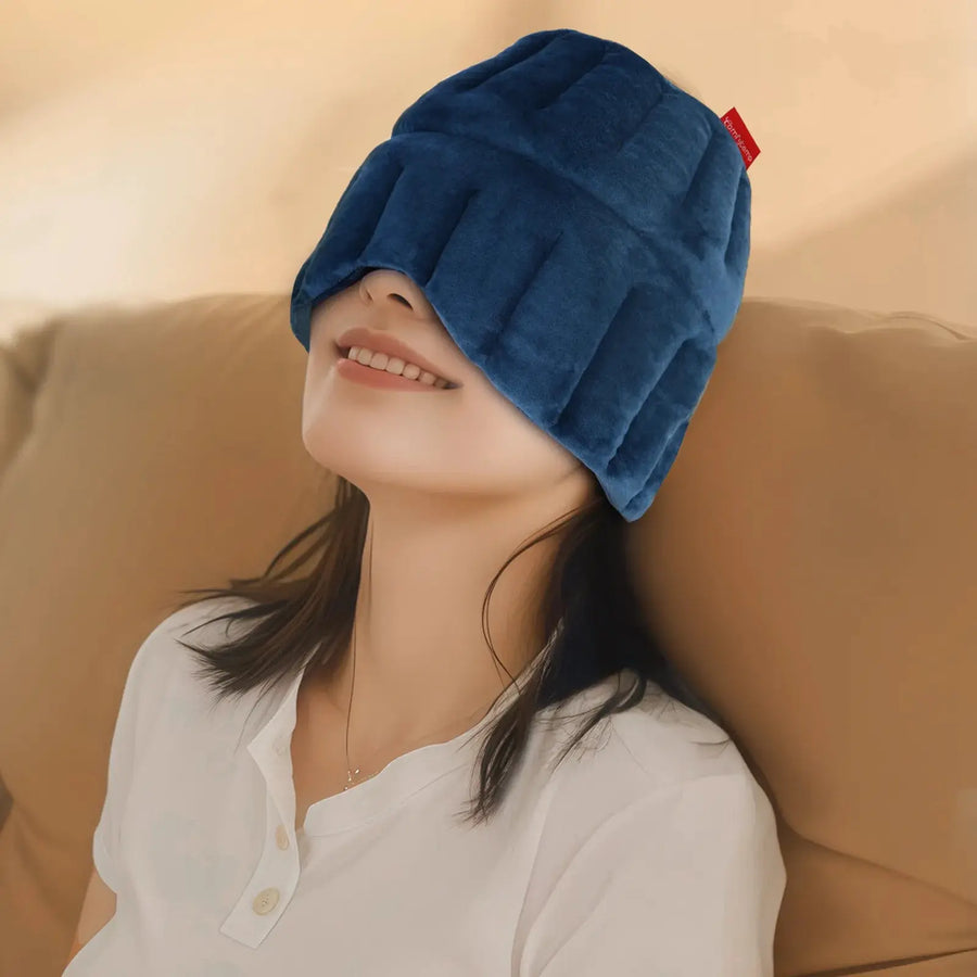 Woman wearing blue migraine ice head wrap