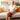 Elderly woman wearing a 3D embrace design knee massager wrap for comfortable joint relief.