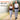 A smiling couple walks outdoors wearing wire-free red light therapy belts for mobile pain relief.
