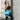 Woman wearing a Comfytemp blue ice pack wrap on her hip for recovery and pain relief.