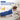 Man lying on bed using an extra large heating pad for back pain relief with 3 temperature settings.