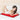 Woman lying on a large red light therapy mat in bed while using her smartphone.