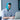 A man wearing a blue wisdom tooth ice pack head wrap while working on a laptop.