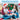Man in a Santa hat gifting a microwave heating pad to a woman sitting by a Christmas tree.