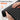 Hands demonstrating the flexible and soft-touch material of a Comfytemp light therapy pad.