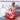 Woman meditating on a red light therapy mat featuring a 20-minute auto-off timer for pain relief.