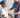 A healthcare professional attaches a wearable health sensor to a patient's arm.