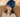 Woman wearing blue migraine ice head wrap