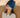 Woman wearing blue migraine ice head wrap
