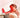 A woman smiles with her eyes closed, sitting near a tabletop red light therapy device on a stand