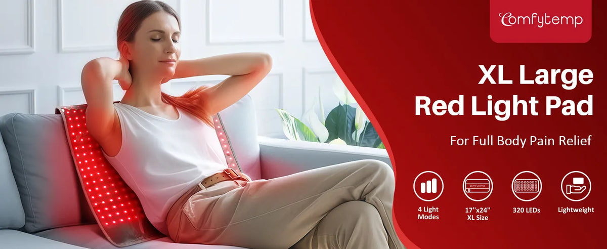 Woman relaxing on a sofa with a large red light therapy pad glowing against her back