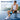 Man wearing blue and black knee ice pack with 45 min text, sitting on track bench for pain relief