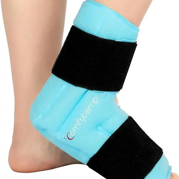 A person wearing a blue ankle ice pack wrap with two black adjustable straps.
