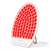 Oval red light therapy panel with adjustable timer and stand on a white background.