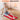Red LED therapy mat with auto-off timer, woman using it for 20 minutes daily comfort.
