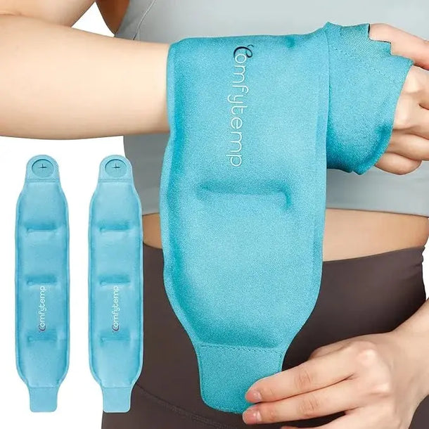A person wearing a blue Comfytemp wrist and hand ice pack wrap with two spare packs on the side.