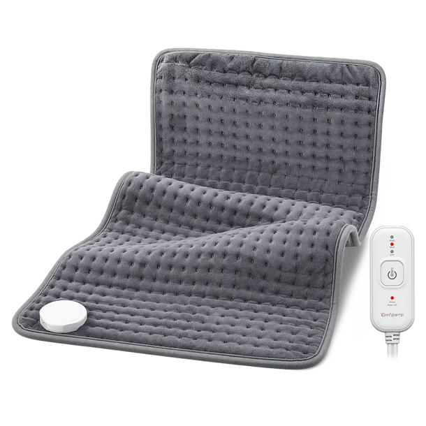 Grey plush electric heating pad with a white remote control.
