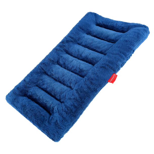 Woman wearing an 8x16 inch blue heating pad with circular insets showing seed and bead fillings.
