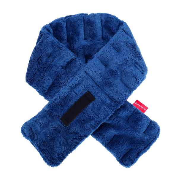 Blue plush weighted neck heating pad with a black strap and red brand tag on a dark background.