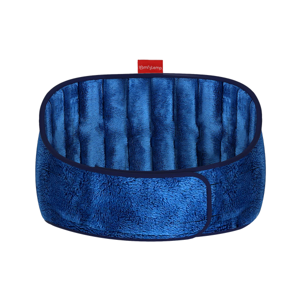 Blue plush, segmented neck heating wrap shown closed in a circular shape.