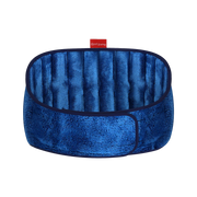 Blue plush, segmented neck heating wrap shown closed in a circular shape.