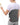 Woman wearing a grey electric heating pad for back pain relief with a handheld remote control.