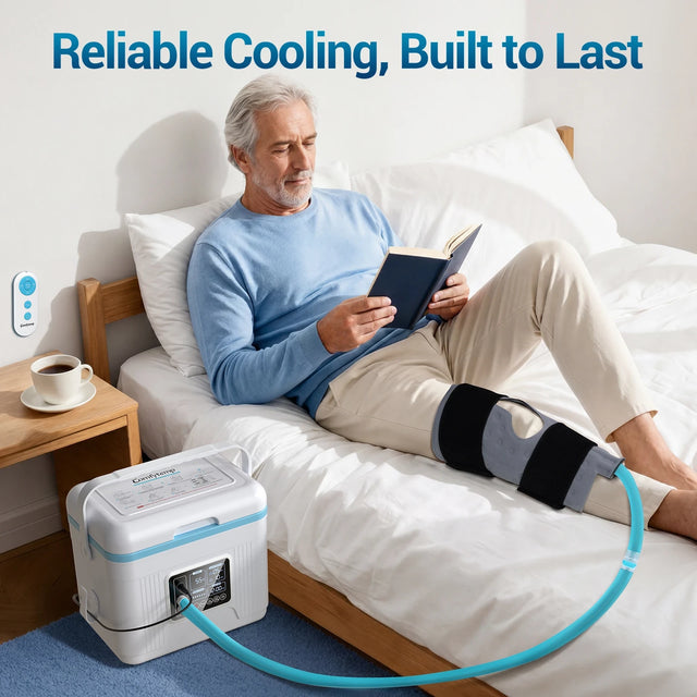 Elderly man reading on a bed while using a durable Comfytemp knee cold therapy system.