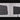 Black LED panel light, front and back views, featuring a grid of lenses and square heat sink pattern.